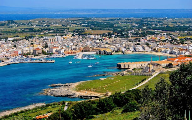 Favignana island view with harbor and boats, part of the Marsala to Levanzo boat tour.