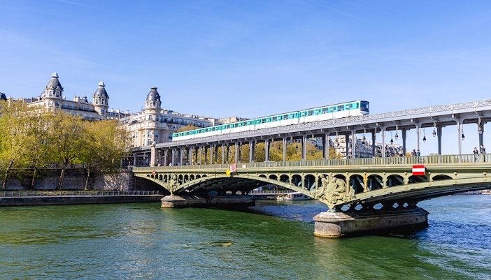 Train crossing Pont de Bir-Hakeim over the Seine River in Paris, France.