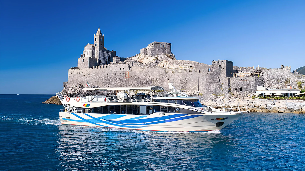 Ferry near historic castle on Cinque Terre guided tour from La Spezia.