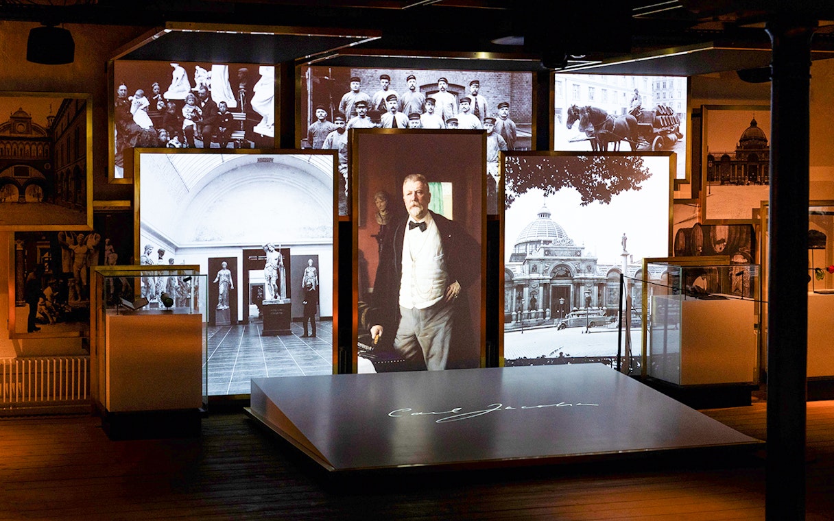 Exhibit of historical photos and artifacts inside the Home of Carlsberg.