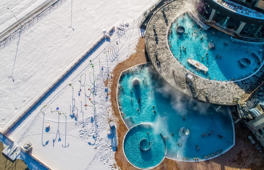 Aerial view of Chochołów Thermal Baths with snowy landscape, part of Krakow skiing tour.