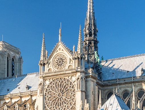 Notre Dame Cathedral facade with intricate rose window, Paris.