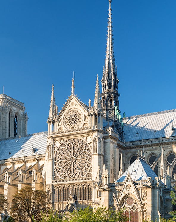 Notre Dame Cathedral facade with intricate rose window, Paris.