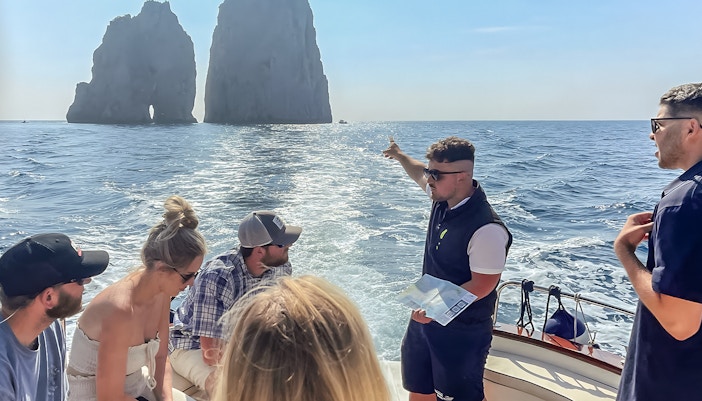 Capri coastline view with boats, part of All-Inclusive Tour from Pompeii or Naples.