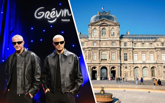 DJ Snake wax statue at Grévin Paris with museum facade in background.