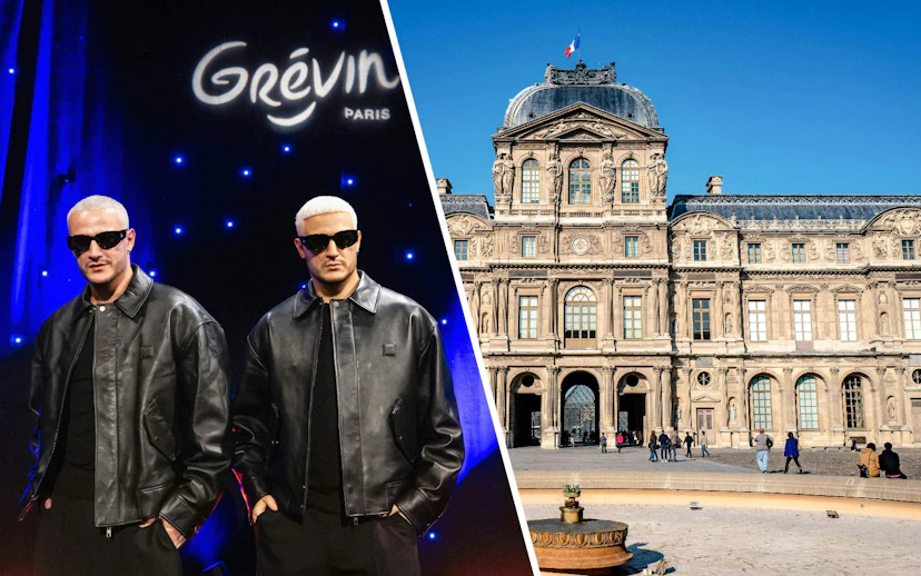 DJ Snake wax statue at Grévin Paris with museum facade in background.