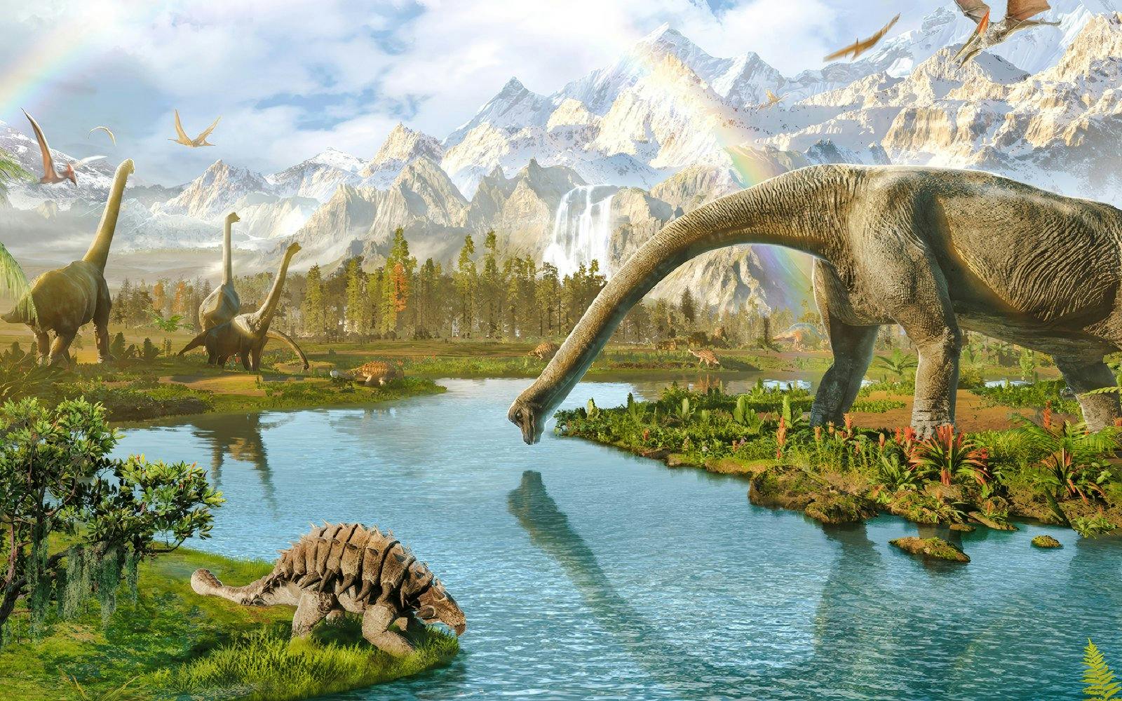 Dinosaurs by a river with mountains in the background at Dino Rescue Squad VR Experience.