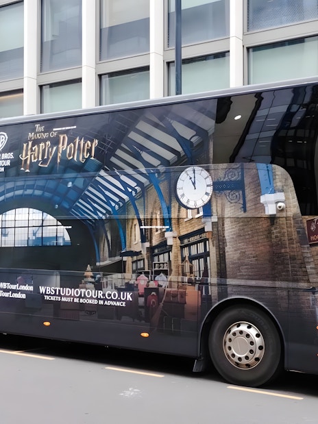 Harry Potter Warner Bros. Studio Tour coach in London with Hogwarts Express design.