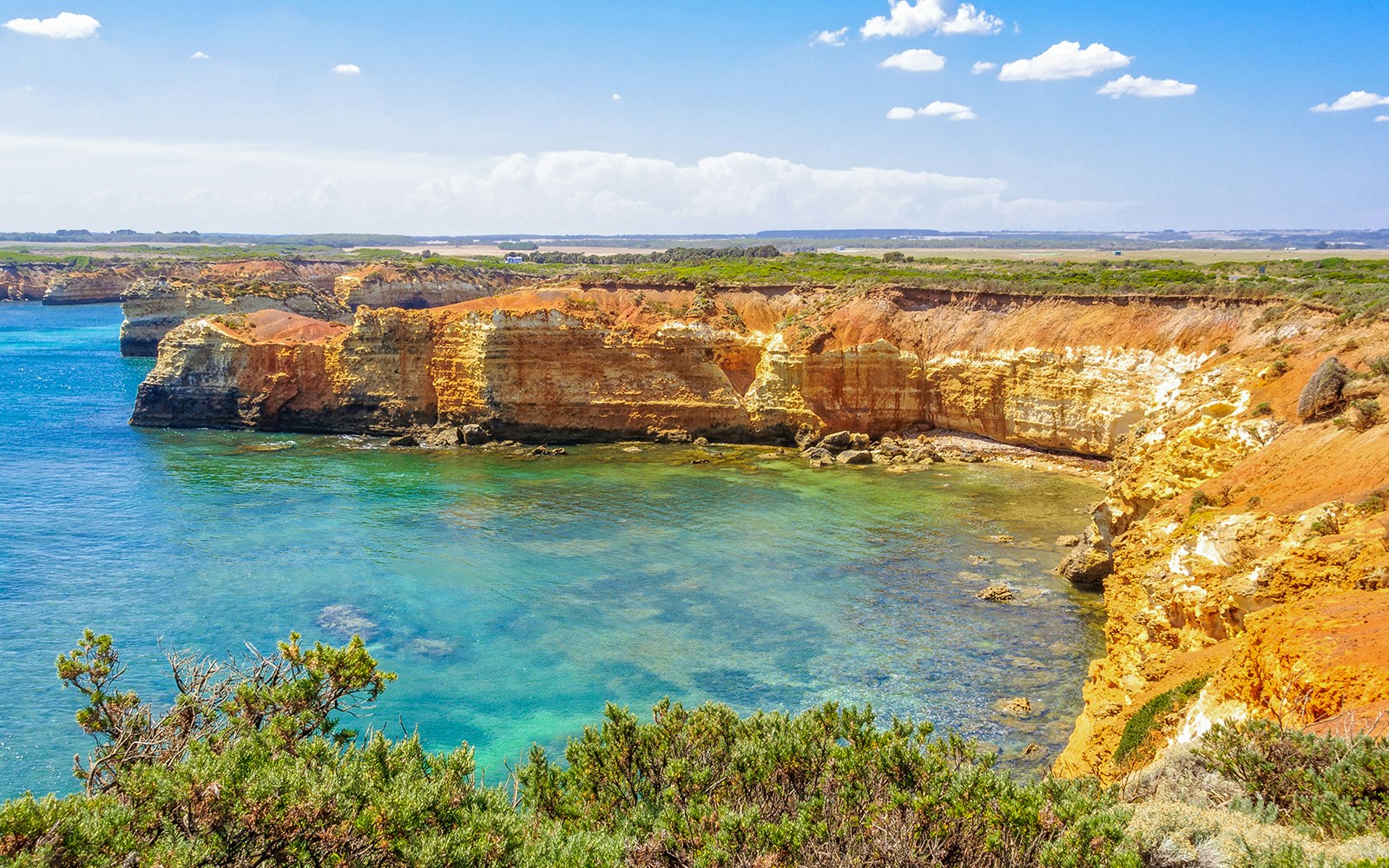 Bay of Martyrs coastline view along Great Ocean Road, Australia, with rocky cliffs and ocean waves.