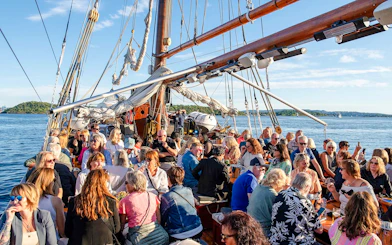 People enjoying a summer evening cruise on the S/S Helena in Oslo.