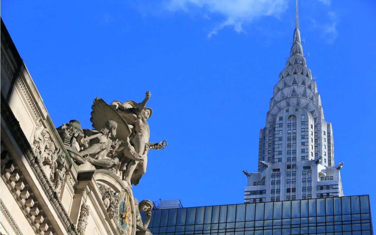 Grand Central Terminal statues with Chrysler Building in New York City.