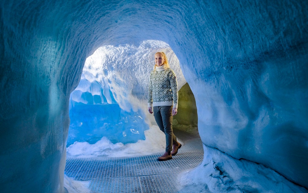 Guests walking through an ice cave exhibit at Perlan Museum in Reykjavik.