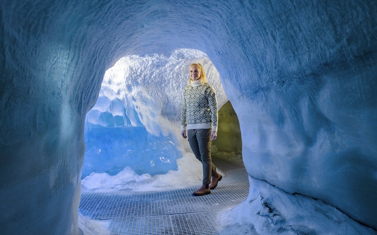 Guests walking through an ice cave exhibit at Perlan Museum in Reykjavik.