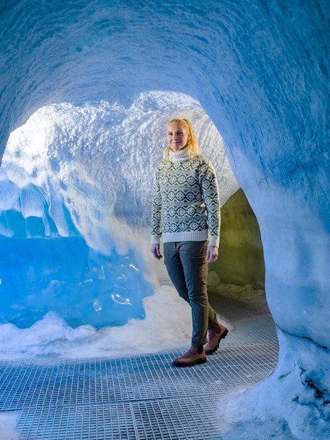 Guests walking through an ice cave exhibit at Perlan Museum in Reykjavik.