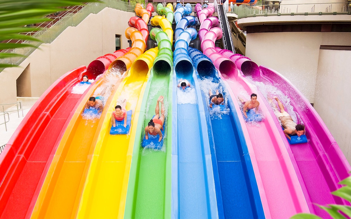 Visitors enjoying colorful water slides at Water World Ocean Park Hong Kong.