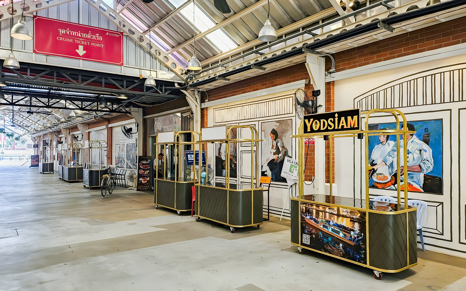 Yodsiam Sightseeing cruise check-in counter at a decorated terminal.