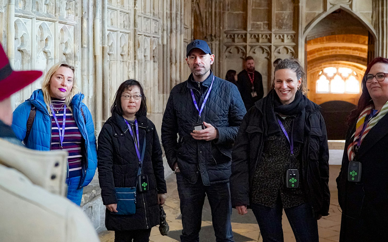 Visitors with guide and audio devices inside Windsor Castle.