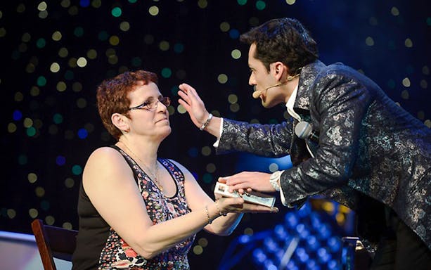 Performer interacting with audience member at PARANORMAL featuring Frederick Da Silva Vegas show.
