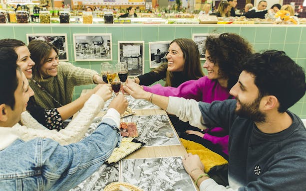 Group enjoying wine and cheese at a Porto food tour.