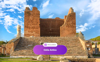 Ancient Roman theater ruins at Ostia Antica under a blue sky.