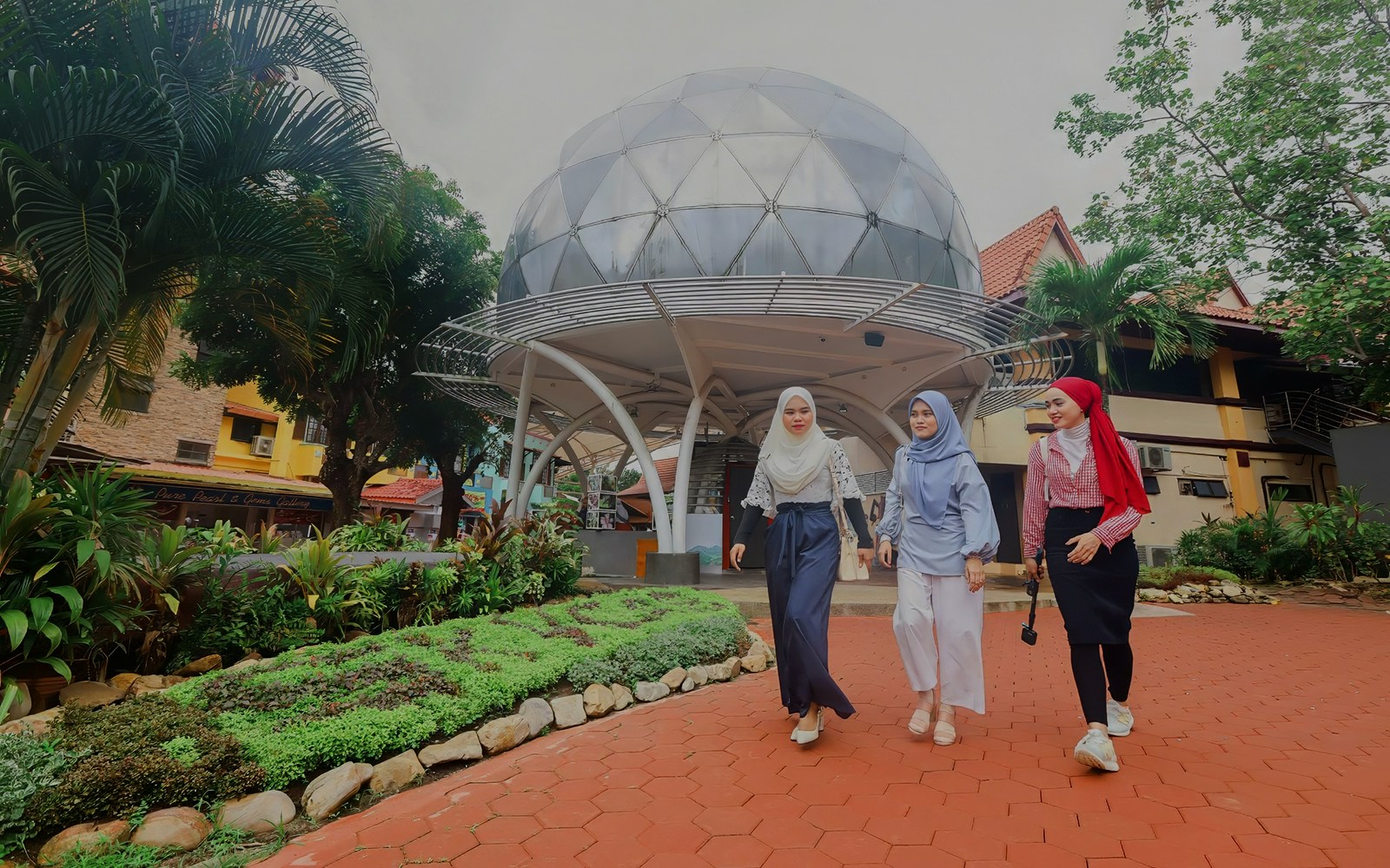 Women walking in front of Skydome Langkawi