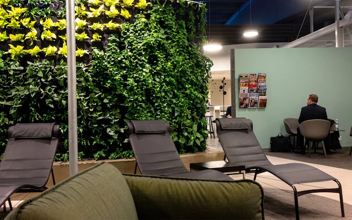 Lounge chairs and vertical garden at Pearl Lounge, Stockholm Arlanda Airport Terminal 2.