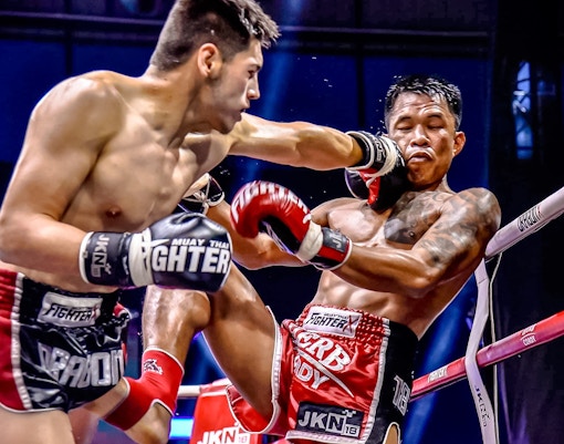 Muay Thai fighters in action at Patong Boxing Stadium, Phuket.
