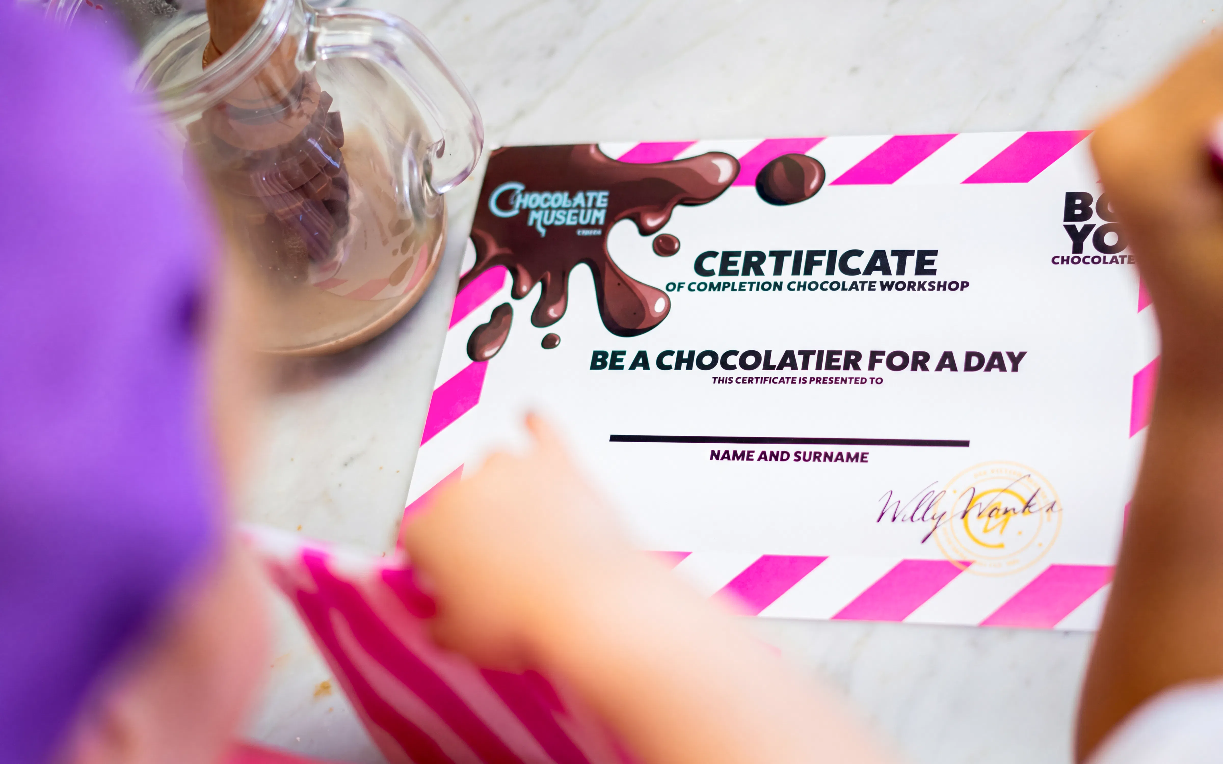 Certificate from Chocolate Museum Vienna workshop on table.