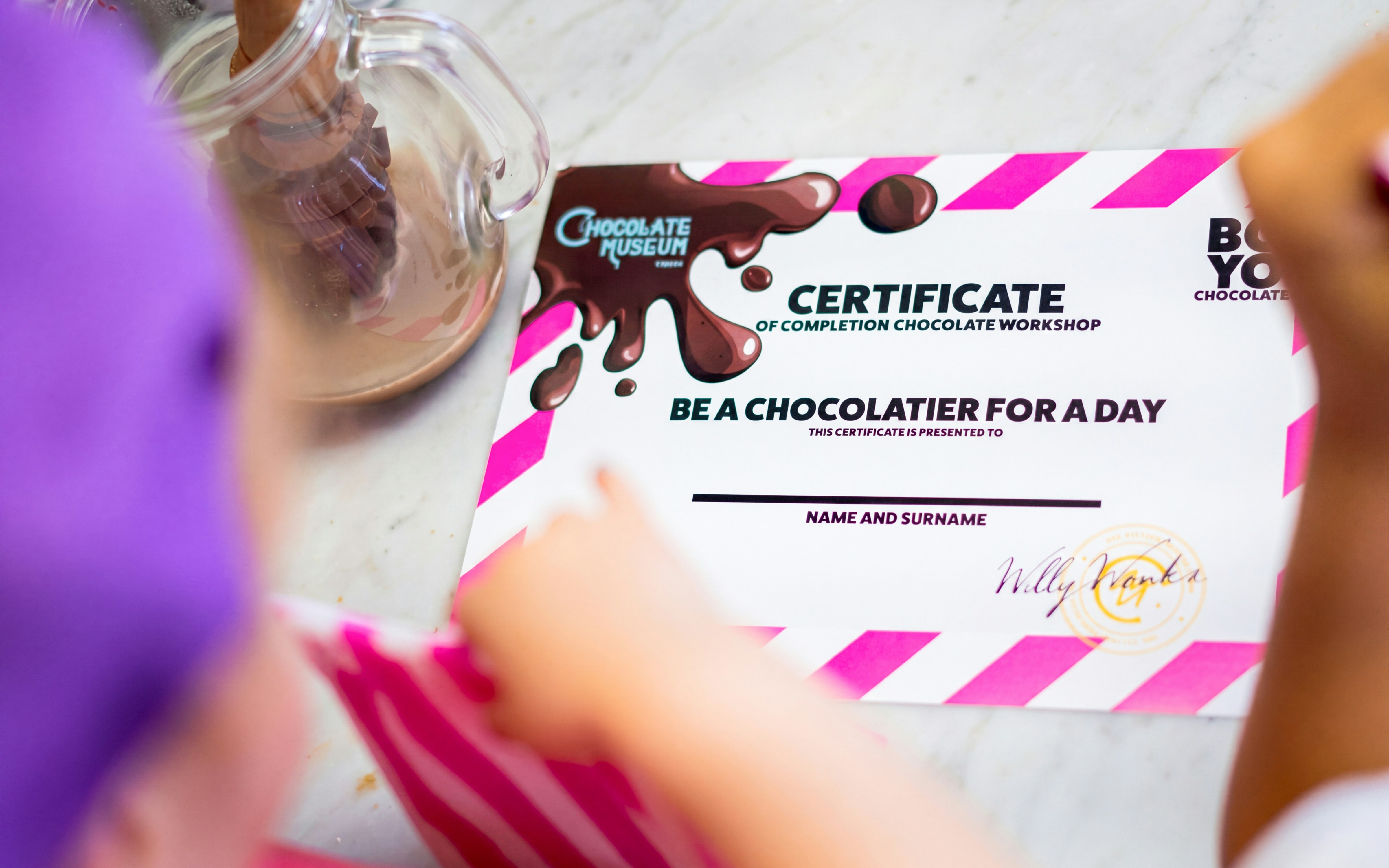 Certificate from Chocolate Museum Vienna workshop on table.