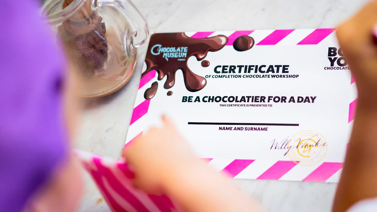 Certificate from Chocolate Museum Vienna workshop on table.