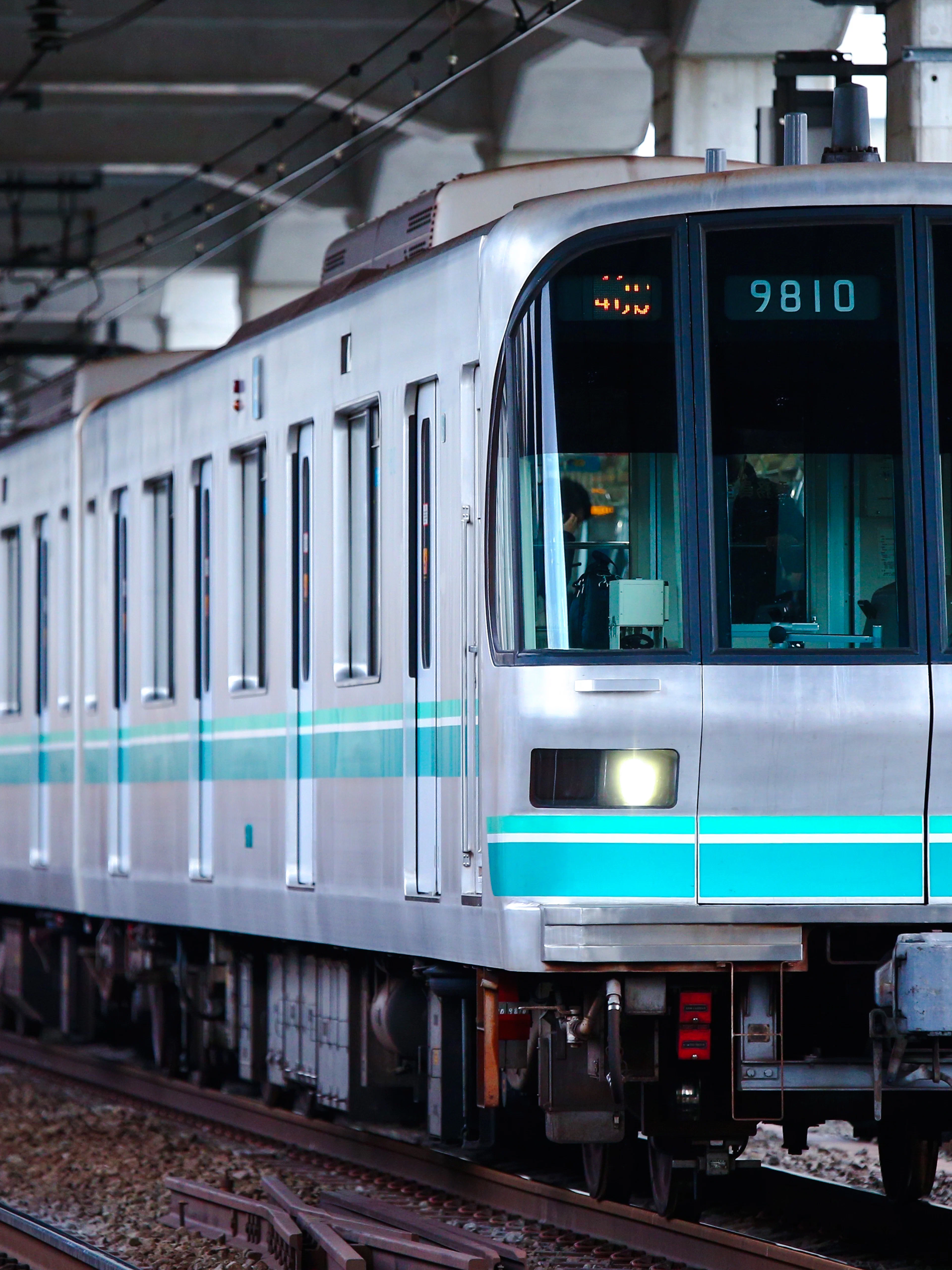 Namboku Line 9000 series train approaching Nakano station in Tokyo.