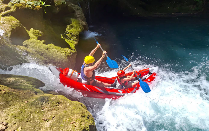 Tourists kayaking through rapids in Mrežnica Canyon Waterfalls, Split.