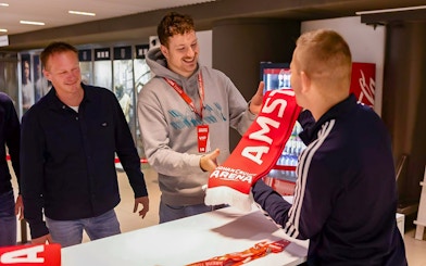 Visitors receiving a scarf during a VIP tour at Johan Cruijff ArenA, Amsterdam.