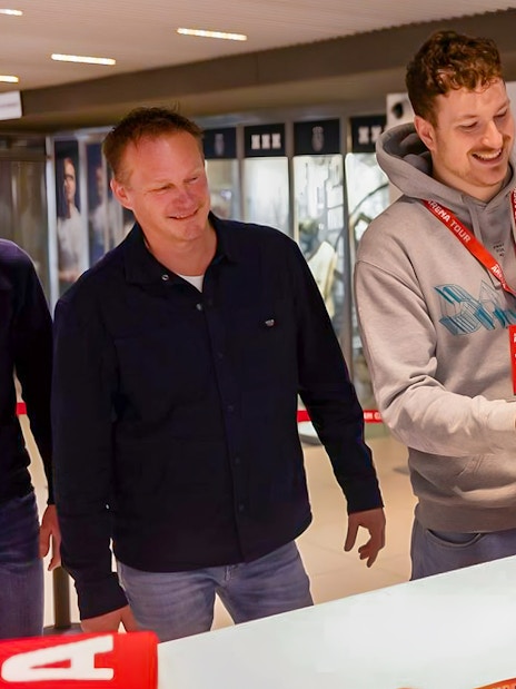 Visitors receiving a scarf during a VIP tour at Johan Cruijff ArenA, Amsterdam.