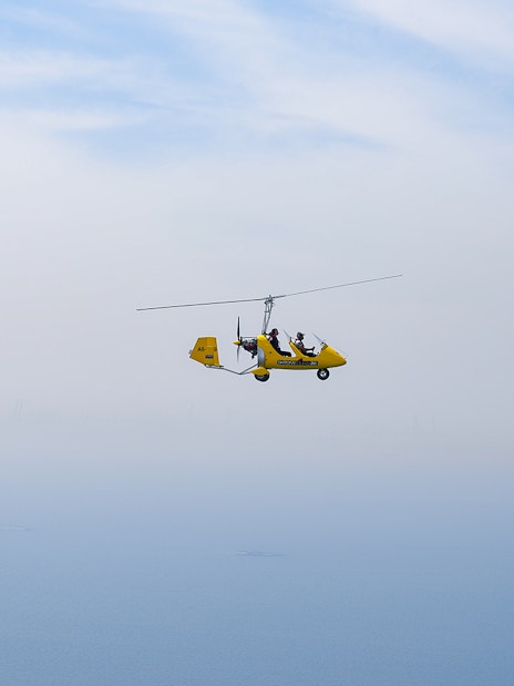 Gyrocopter flying near Ain Dubai at Skydive Dubai Palm Drop Zone.