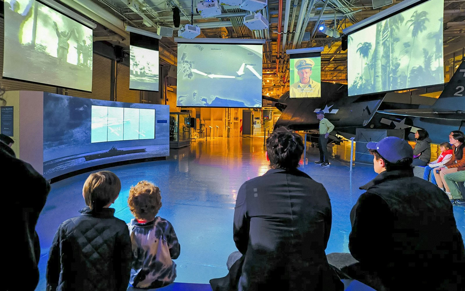 Visitors exploring aircraft exhibits at the Intrepid Sea, Air & Space Museum in New York, available in a combo deal saving 27%