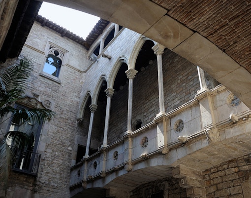 Stone courtyard arches at Picasso Museum, Barcelona.