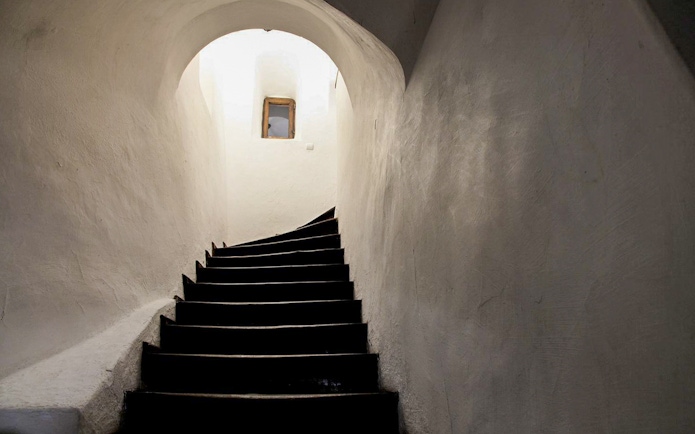 Curved staircase leading to a secret passageway inside Bran Castle, Transylvania, Romania.
