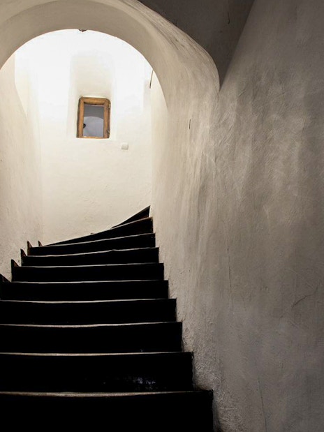 Curved staircase leading to a secret passageway inside Bran Castle, Transylvania, Romania.