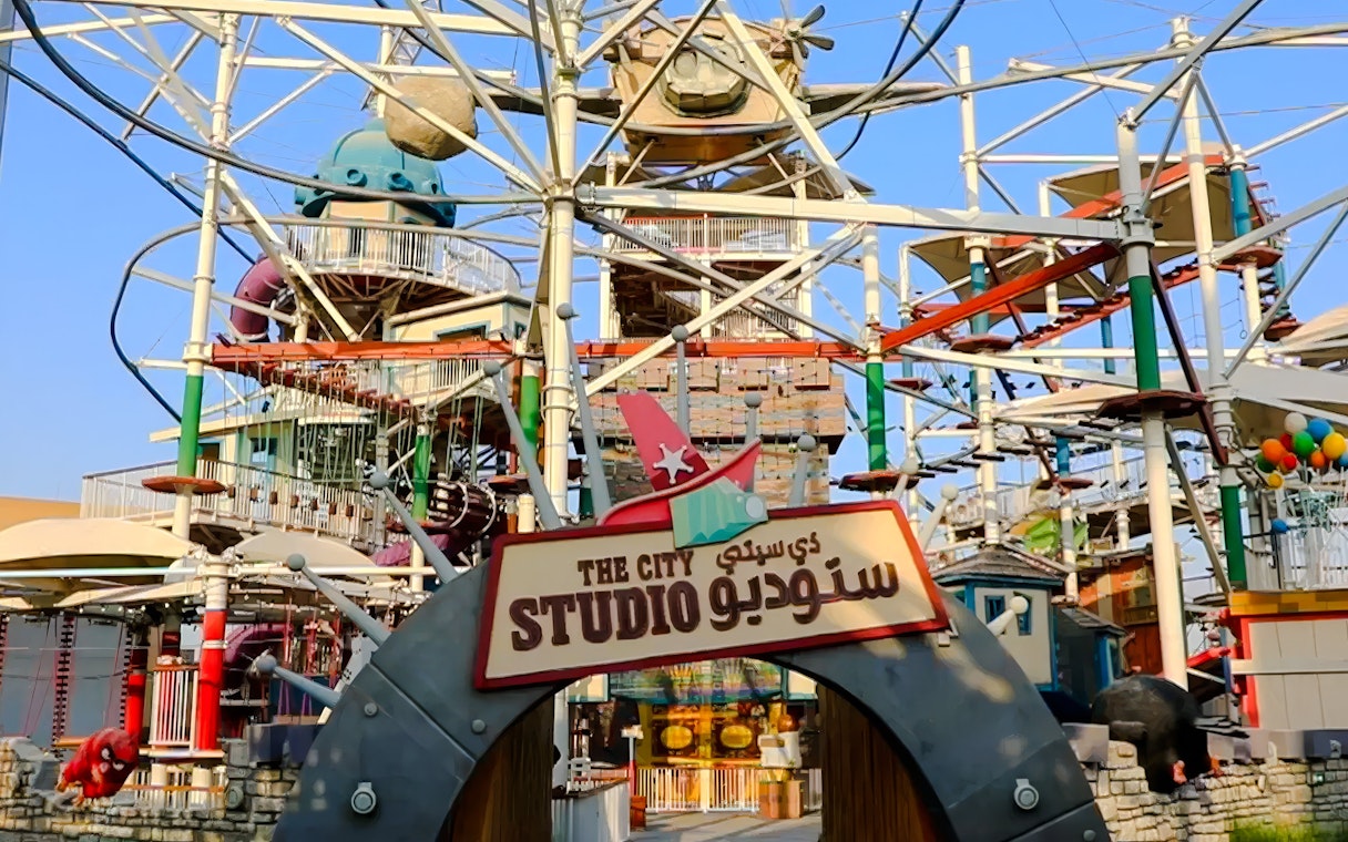 City Studio entrance at Angry Birds World Theme Park with colorful structures and rides.