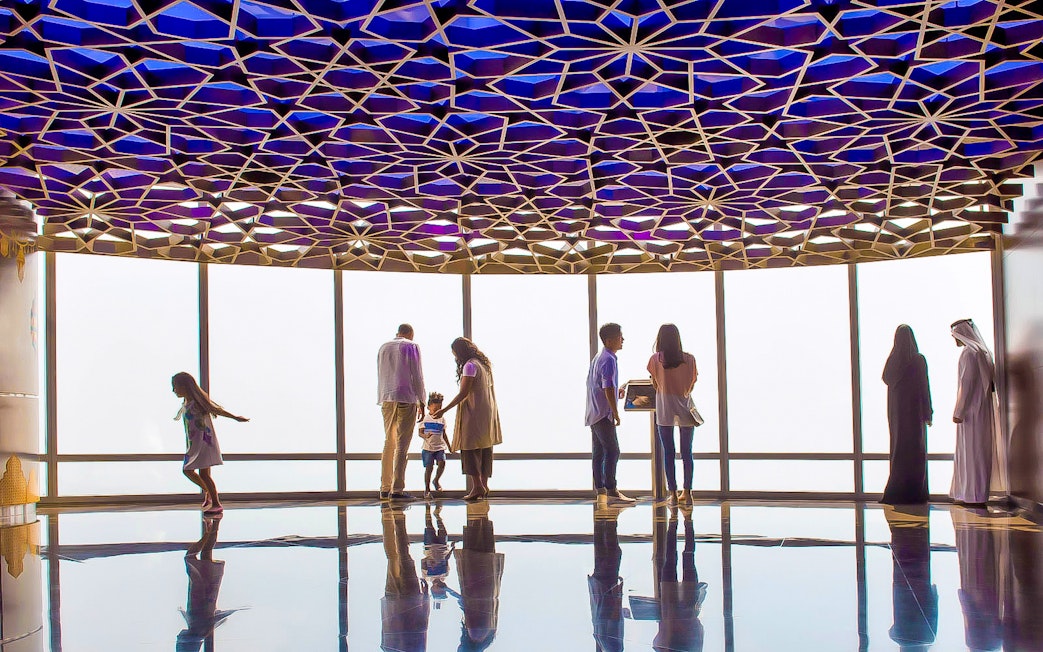 Visitors enjoying the view from Burj Khalifa observation deck, Dubai.