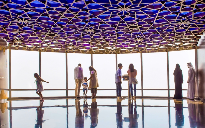 Visitors enjoying the view from Burj Khalifa observation deck, Dubai.