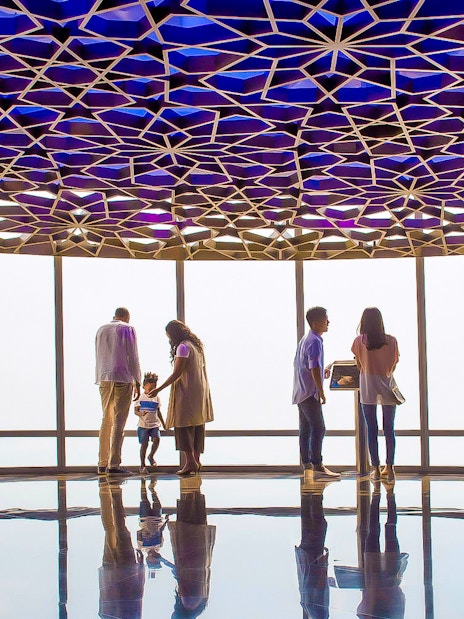 Visitors enjoying the view from Burj Khalifa observation deck, Dubai.