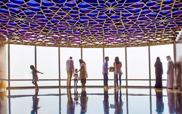 Visitors enjoying the view from Burj Khalifa observation deck, Dubai.