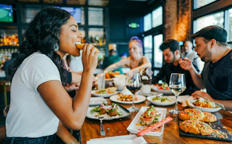 Dining experience on Taste of Bucharest tour with diverse dishes and drinks.