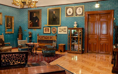 Franz Liszt House Museum interior with portraits and antique furniture in Budapest.