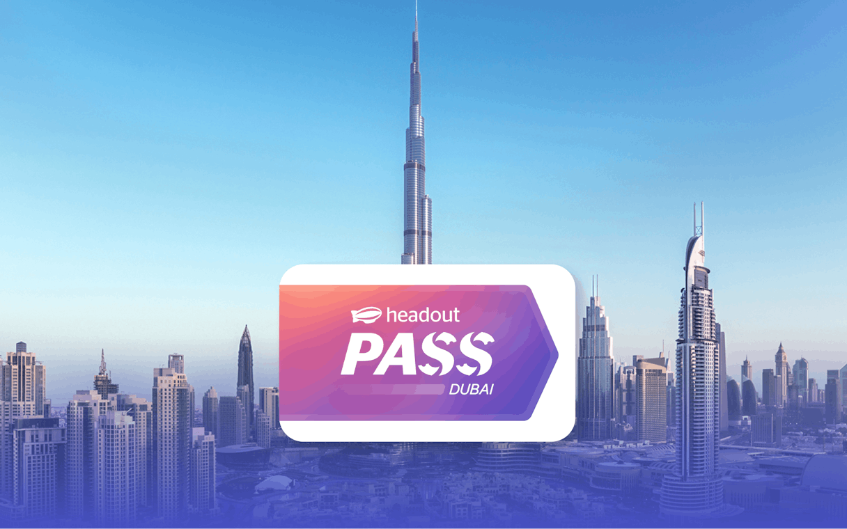 Burj Khalifa towering over Dubai skyline with Headout Pass logo in foreground.