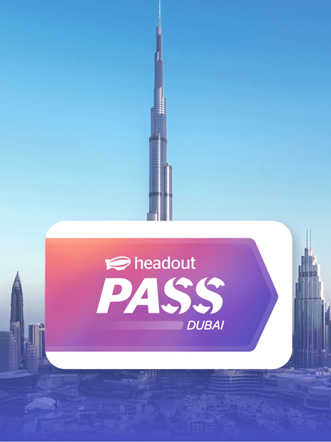 Burj Khalifa towering over Dubai skyline with Headout Pass logo in foreground.