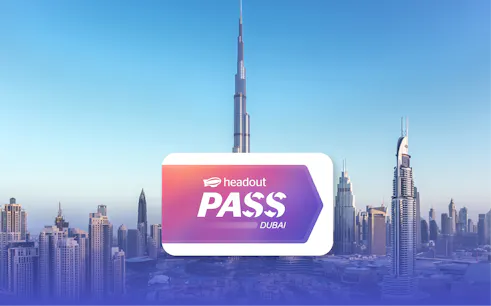 Burj Khalifa towering over Dubai skyline with Headout Pass logo in foreground.