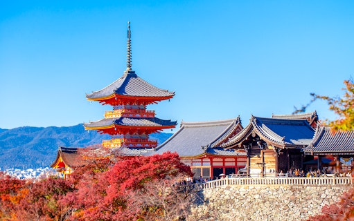 Kyoto's Kiyomizu-dera Temple with autumn foliage, part of the Osaka to Kyoto Sagano Day Tour.